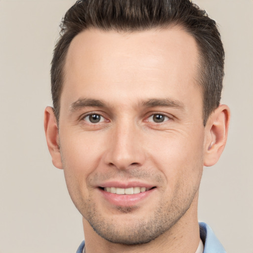 Joyful white young-adult male with short  brown hair and brown eyes