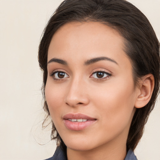 Joyful white young-adult female with medium  brown hair and brown eyes