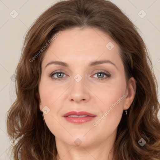 Joyful white adult female with long  brown hair and brown eyes