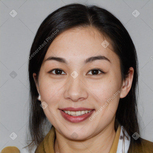 Joyful asian young-adult female with medium  brown hair and brown eyes