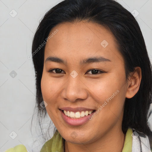 Joyful asian young-adult female with medium  brown hair and brown eyes