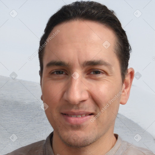 Joyful white adult male with short  brown hair and brown eyes