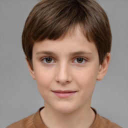 Joyful white child male with short  brown hair and brown eyes