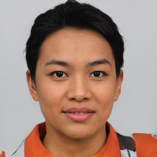 Joyful asian young-adult female with short  black hair and brown eyes