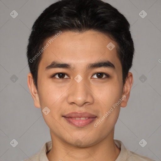 Joyful asian young-adult male with short  brown hair and brown eyes