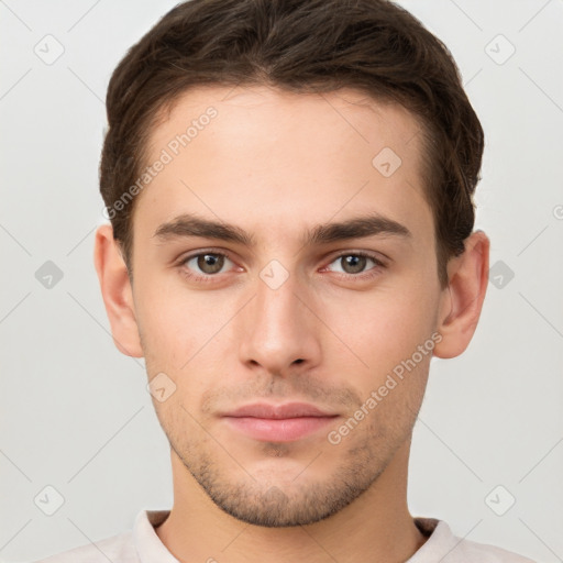 Neutral white young-adult male with short  brown hair and brown eyes