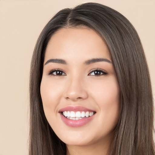 Joyful white young-adult female with long  black hair and brown eyes