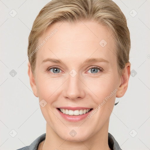 Joyful white young-adult female with short  brown hair and grey eyes