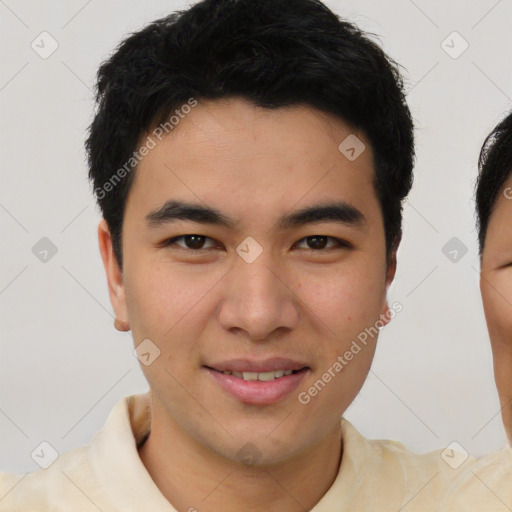 Joyful asian young-adult male with short  brown hair and brown eyes