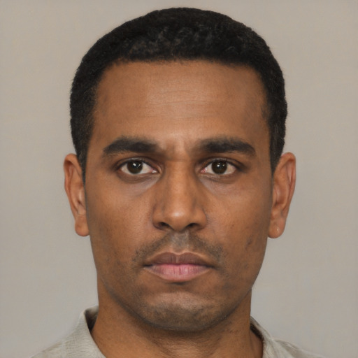 Neutral latino young-adult male with short  black hair and brown eyes