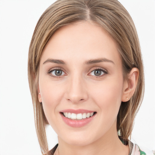 Joyful white young-adult female with long  brown hair and grey eyes