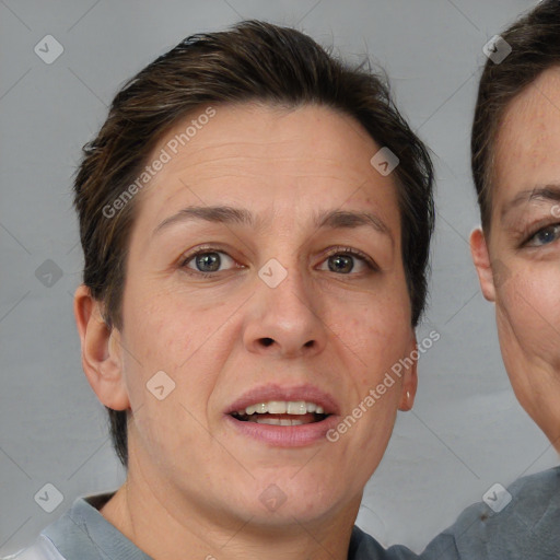 Joyful white adult female with short  brown hair and brown eyes