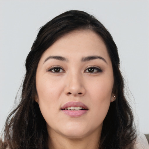 Joyful white young-adult female with long  black hair and brown eyes