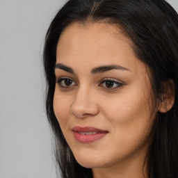 Joyful asian young-adult female with long  brown hair and brown eyes