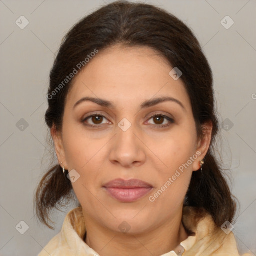 Joyful white adult female with medium  brown hair and brown eyes