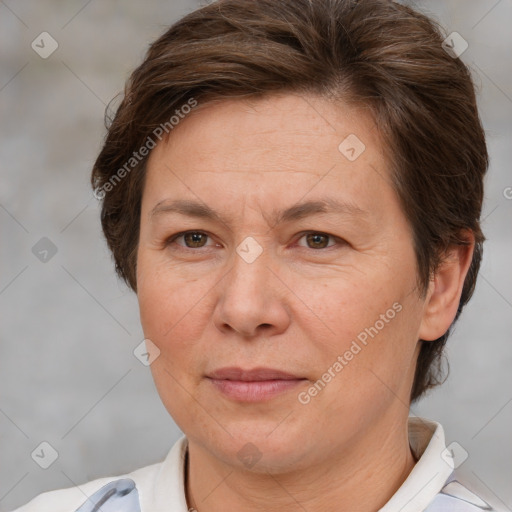 Joyful white adult female with short  brown hair and brown eyes