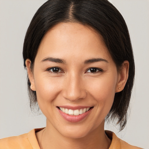 Joyful white young-adult female with medium  brown hair and brown eyes