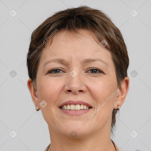 Joyful white adult female with short  brown hair and brown eyes