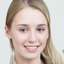 Joyful white young-adult female with long  brown hair and blue eyes