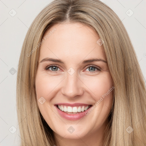 Joyful white young-adult female with long  brown hair and brown eyes