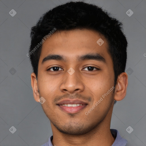 Joyful latino young-adult male with short  black hair and brown eyes