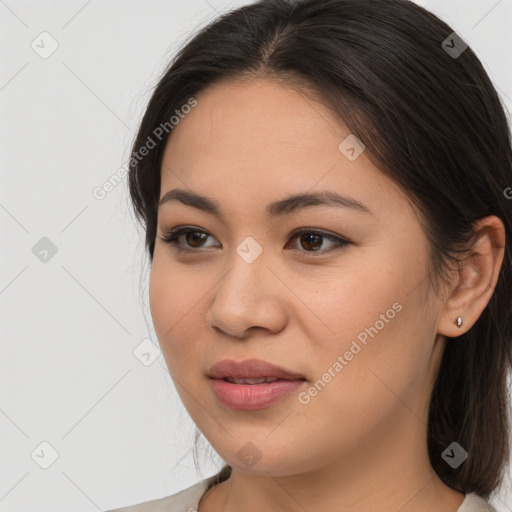 Joyful latino young-adult female with medium  brown hair and brown eyes