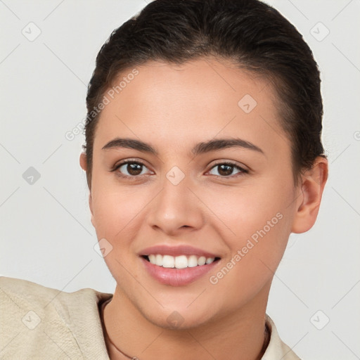 Joyful white young-adult female with short  brown hair and brown eyes