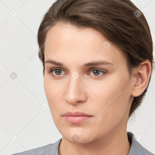 Neutral white young-adult female with short  brown hair and brown eyes