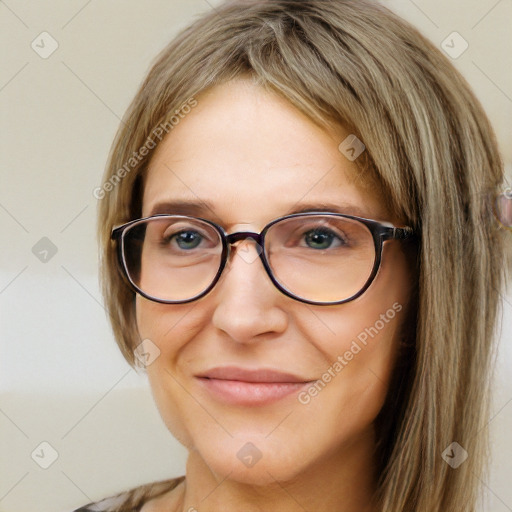 Joyful white adult female with long  brown hair and brown eyes