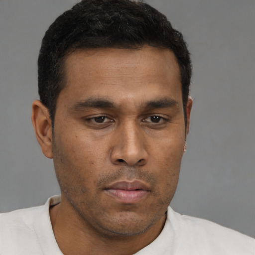 Neutral black young-adult male with short  brown hair and brown eyes