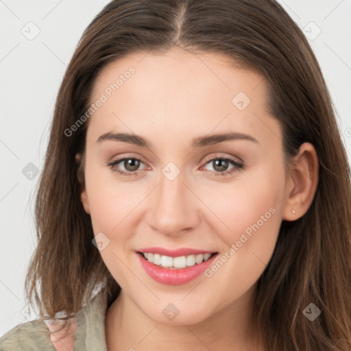 Joyful white young-adult female with long  brown hair and grey eyes