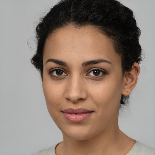 Joyful latino young-adult female with short  brown hair and brown eyes