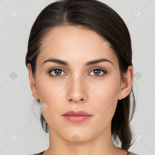 Neutral white young-adult female with medium  brown hair and brown eyes