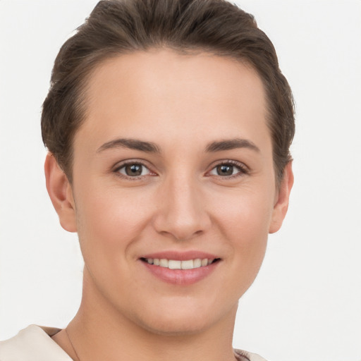 Joyful white young-adult female with short  brown hair and brown eyes