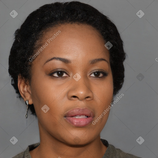 Joyful black young-adult female with short  brown hair and brown eyes