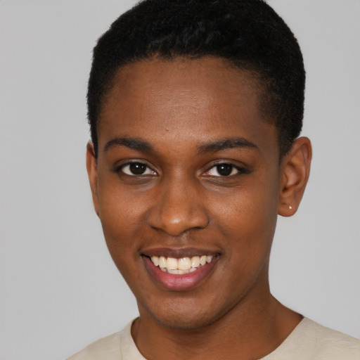 Joyful black young-adult female with short  black hair and brown eyes