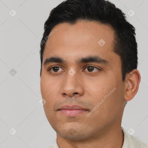 Neutral latino young-adult male with short  black hair and brown eyes