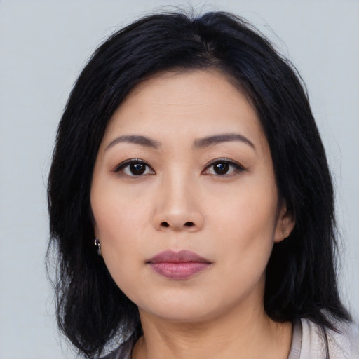 Neutral asian young-adult female with medium  black hair and brown eyes