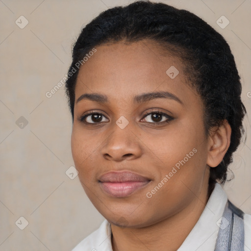 Joyful black young-adult female with medium  black hair and brown eyes