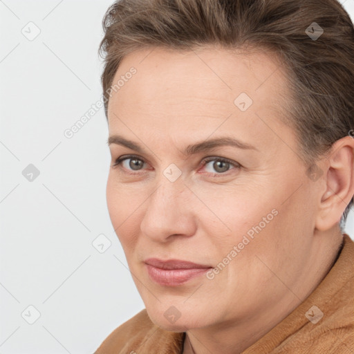 Joyful white adult female with short  brown hair and brown eyes