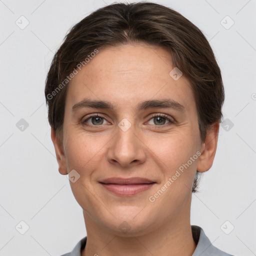 Joyful white young-adult female with short  brown hair and grey eyes