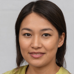 Joyful white young-adult female with medium  brown hair and brown eyes