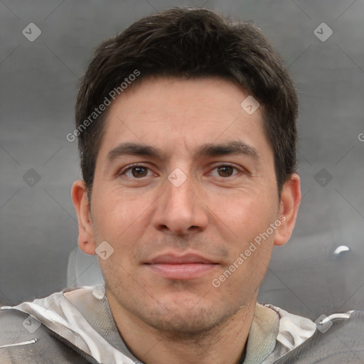 Joyful white adult male with short  brown hair and brown eyes