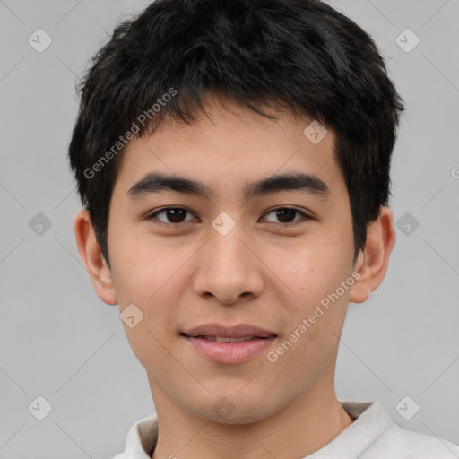 Joyful asian young-adult male with short  brown hair and brown eyes