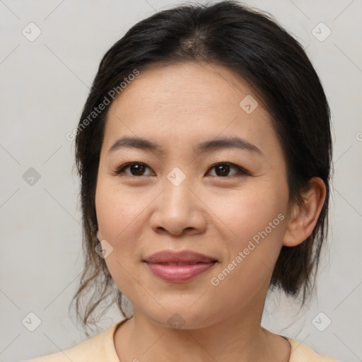 Joyful asian young-adult female with medium  brown hair and brown eyes