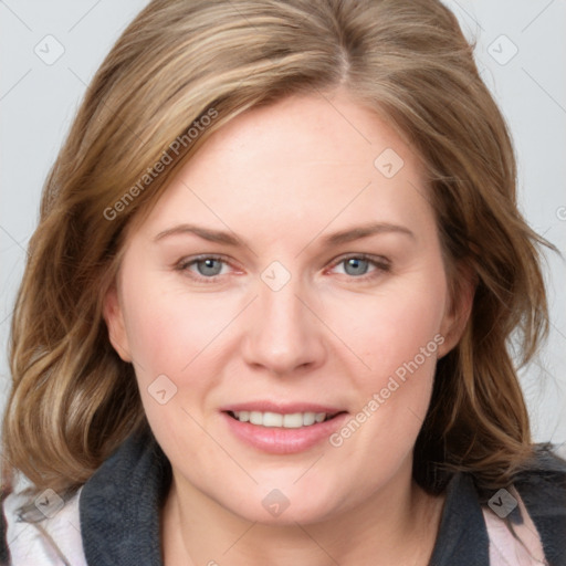 Joyful white young-adult female with medium  brown hair and blue eyes