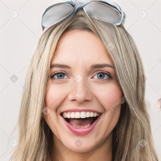 Joyful white young-adult female with long  brown hair and blue eyes