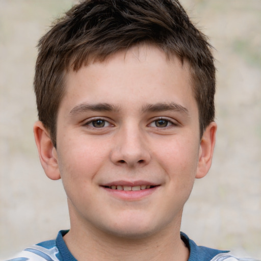 Joyful white child male with short  brown hair and brown eyes