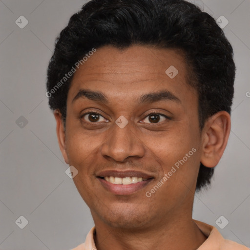 Joyful black adult male with short  black hair and brown eyes