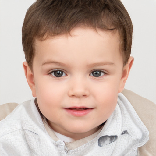 Joyful white child male with short  brown hair and brown eyes